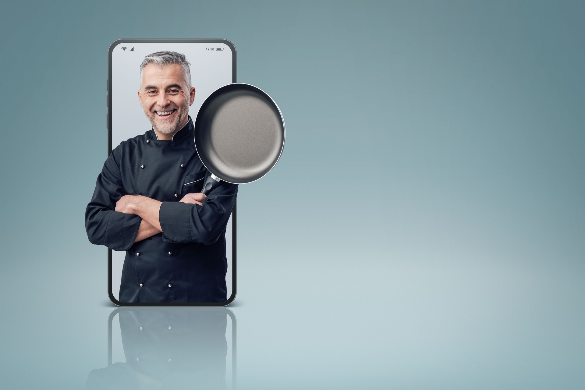 Confident smiling successful chef posing in a smartphone videocall and smiling, online  service concept